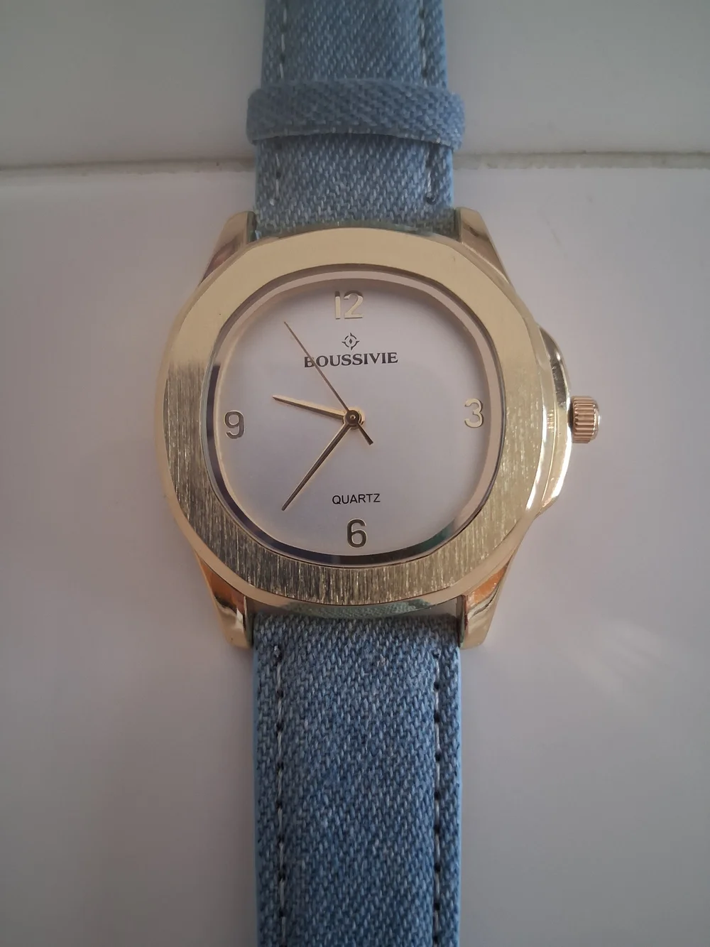Gold-Tone Round Watch with Light Blue Fabric Strap
